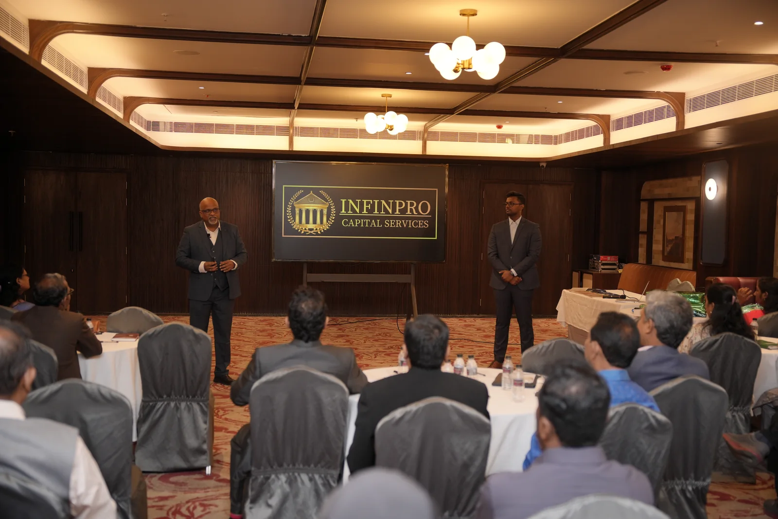 INFINPRO leaders presenting to the summit audience