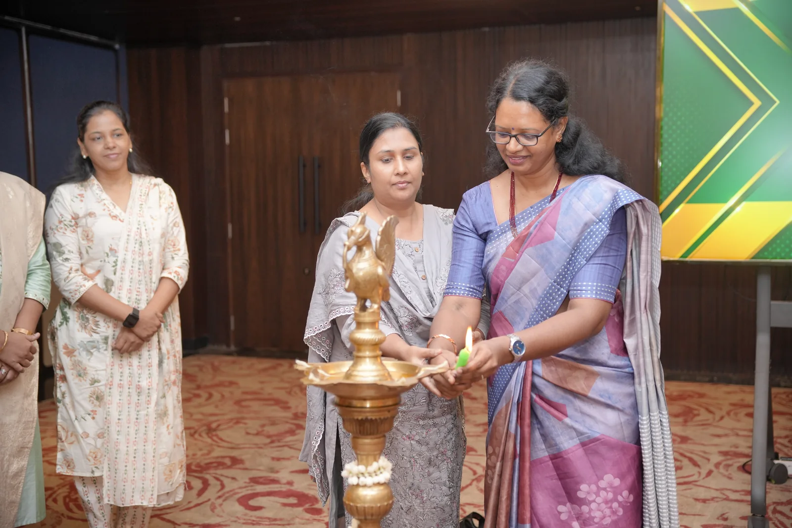 Guests lighting the ceremonial lamp at the Leadership Summit
